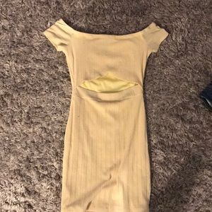 A light yellow dress with a cut in the front